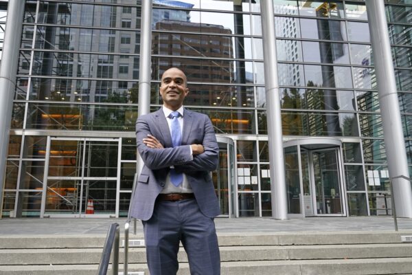 Attorney General Nick Brown poses for a photo outside the U.S. Courthouse on Oct. 19, 2021, in Seattle. 